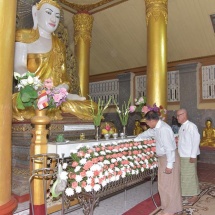 Gold foils offered for second time at the whole structure of historic Shwetaungsar Pagoda, Yadana diamond orb, pennant-shaped vane hoisted atop the pagoda in Dawei