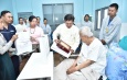 Senior General Min Aung Hlaing  comforts Pa-O ethnic leader U Aung Hkam Hti receiving medical treatment at military hospital