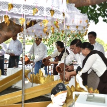Senior General Min Aung Hlaing and wife Daw Kyu Kyu Hla and families of the Office of Commander-in-Chief (Army, Navy and Air) pour water on Bo trees