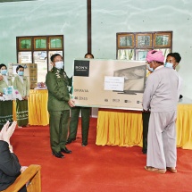 Senior General Min Aung Hlaing meets local ethnic people of Ywangan Township, Danu Self- Administered Zone, and presents books and periodicals for the village library and COVID-19 containment, prevention and treatment aids 