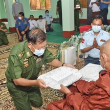 Families of Tatmadaw (Army, Navy and Air) contribute cash donations to tar the Mingan Village main road from Taungniaye Monastery where Moegaung Pagoda built by King Alaungsithu is located and to upgrade PhaungdawU Pagoda mountain road, repair roof of Gandakuti Chamber and pave a concrete road; cordial meeting with locals held