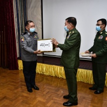 Senior General Min Aung Hlaing presents cash awards to Myanmar Police Force members who made achievements in effective anti-narcotic measures in Shan State
